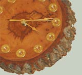 One of Ken Plunk&#x27;s wood-carved clocks.