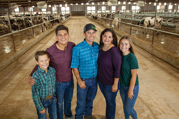 Collier family in dairy barn