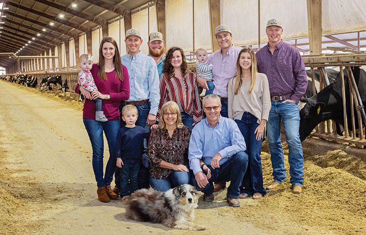 Volleman family in the dairy barn