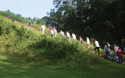 Students hiking up a hill