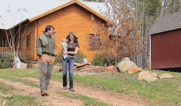 The Creekbaums outdoors on their property