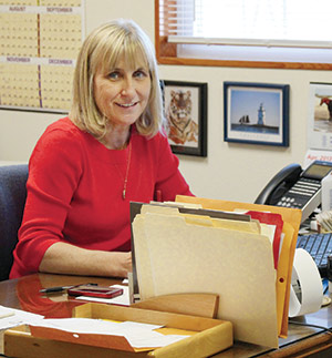 Sharon Feiderhoff at a desk