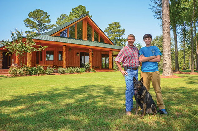 Lovic Wren and his son Brock in front of the Wren home