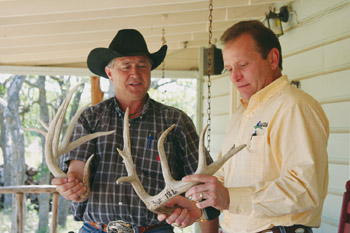 Men holding antlers