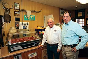 John Sessions and Ed Boyd near a meat warmer