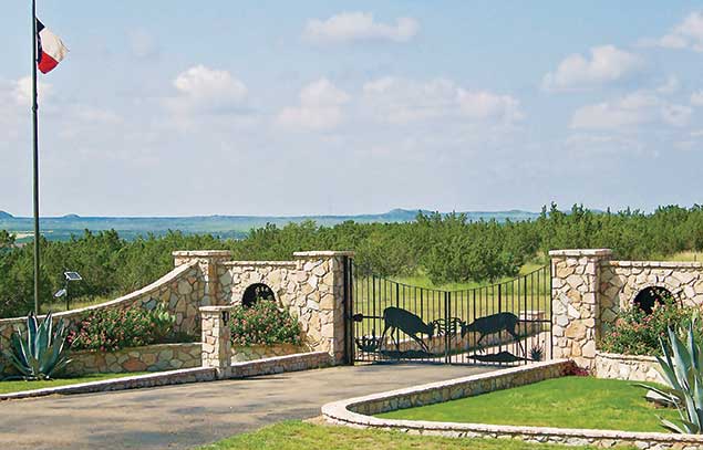 Stone walls and wildlife-themed metalwork at ranch in northwest texas