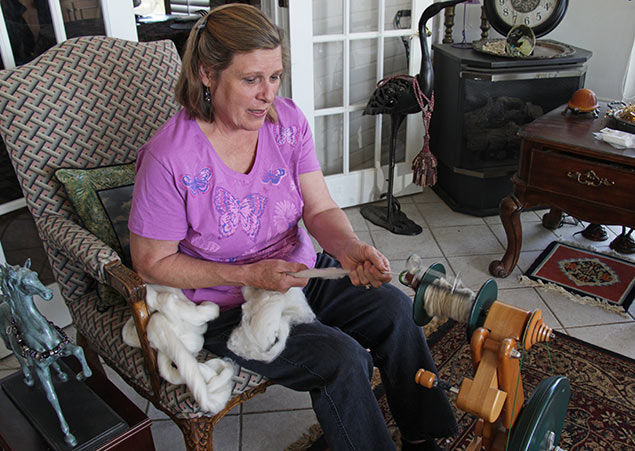 Cozette spins alpaca fiber