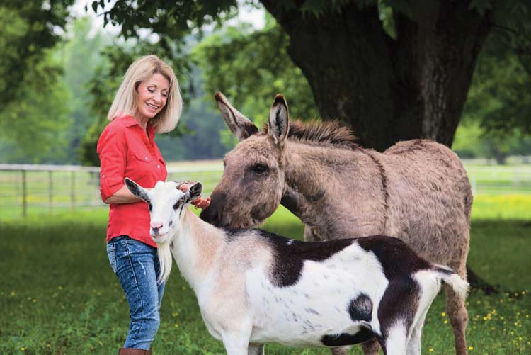 Sharon Young feeding animals