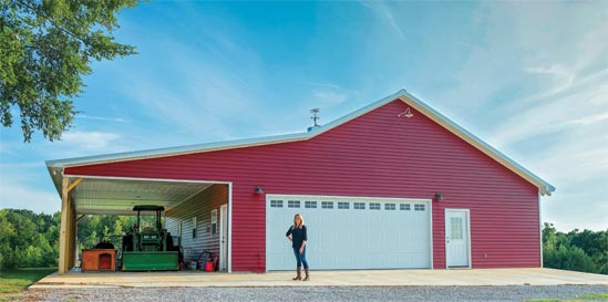 Kari Nash in front of a red barndo