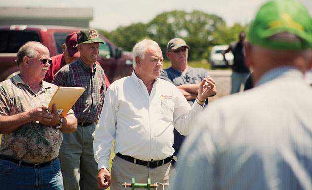 Mickey Fowler and farmers at an auction