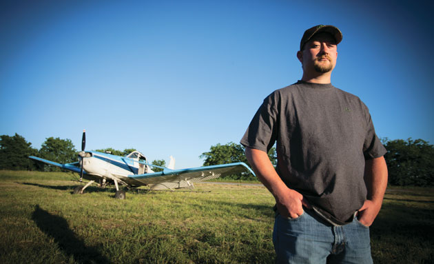 Jesse Shipman standing in front of a cropduster