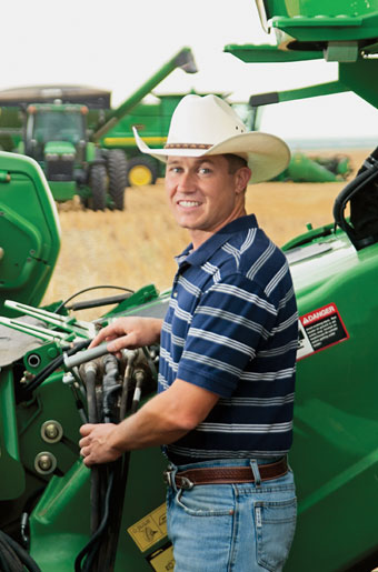 Paul Minzenmayer with some green farm equipment