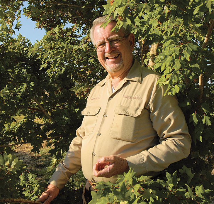 Sam Watson with foliage