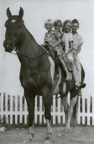 Four siblings on their horse near Waxahachie, Texas — 1943