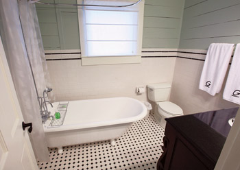 Bathroom after with hex tile and claw foot