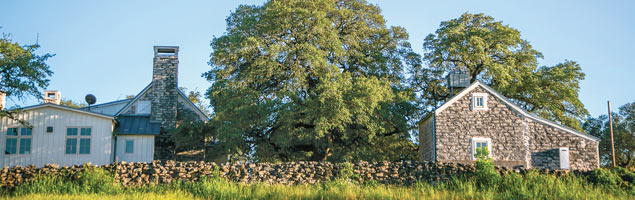 Home and carriage house at heart of 237 acre farm