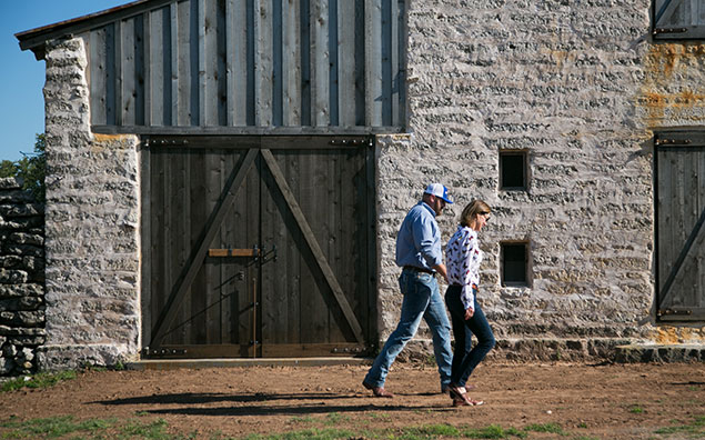 Renovating two-story stone barn.