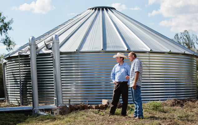 Chad Schmidt, left, and customer David Rose