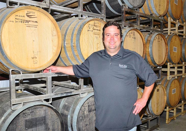 Brad Farbstein with kegs of beer