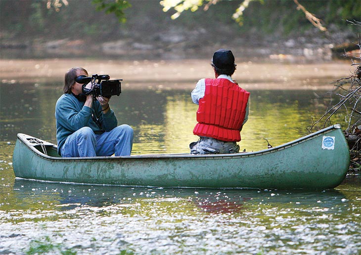 Cameraman Mark Harper and Dr. Phillips in a canoe