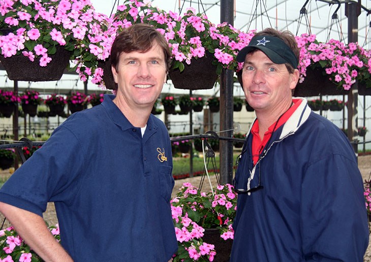 Billy and Bobby Brentlinger in front of pink flowers