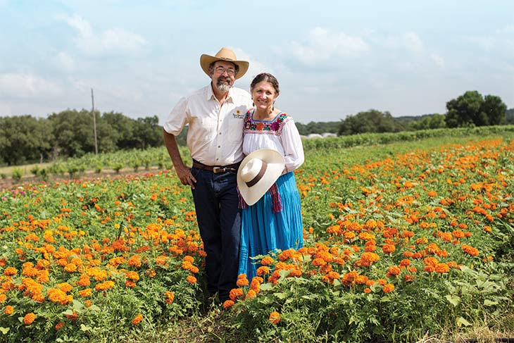 Frank and Pamela in field of marigolds