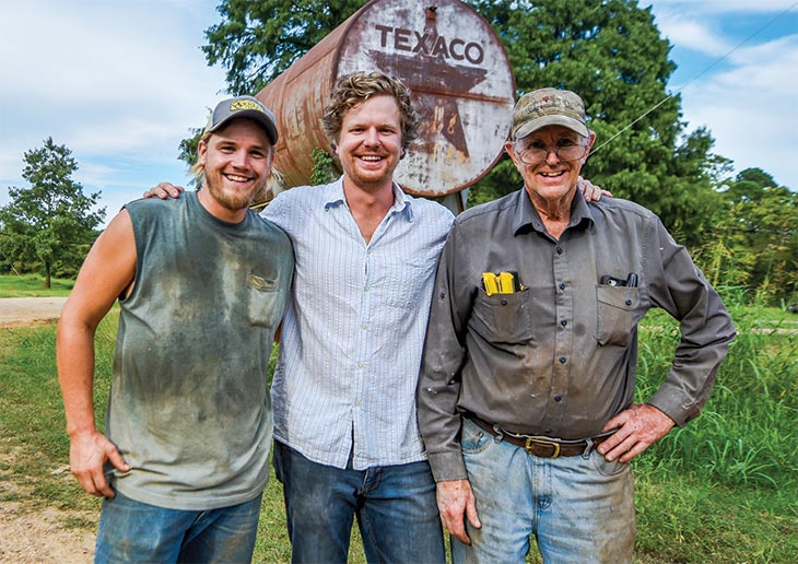 Marshall with dad, Mike, and Josh Heller, farm manager