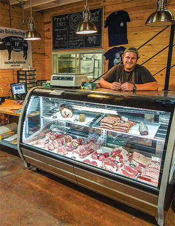 Tucker Larson behind counter