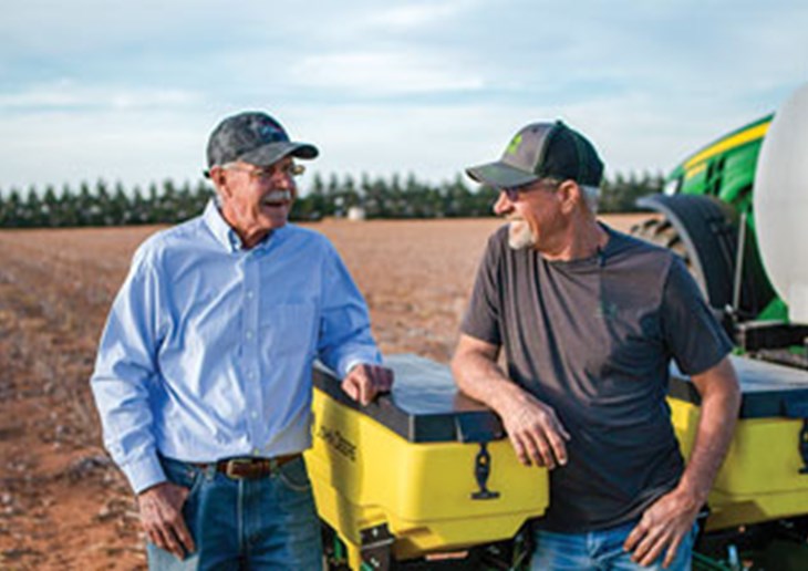 Sam Stanley, left, and his cousin, Len, prepare for planting season on their Levelland, Texas, cotton farms.