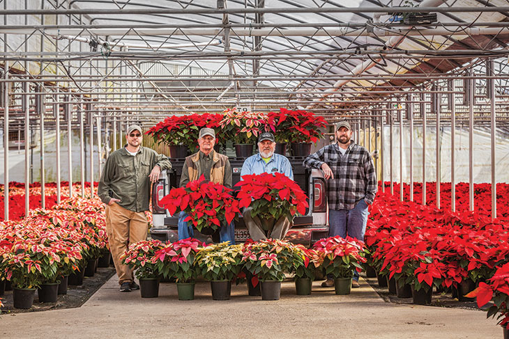 Daniel, Hank, Jerry and John Richardson with poinsettias