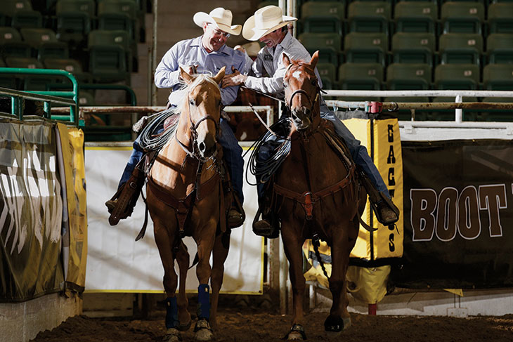 Jody Higgins and Mark Smith ride horseback