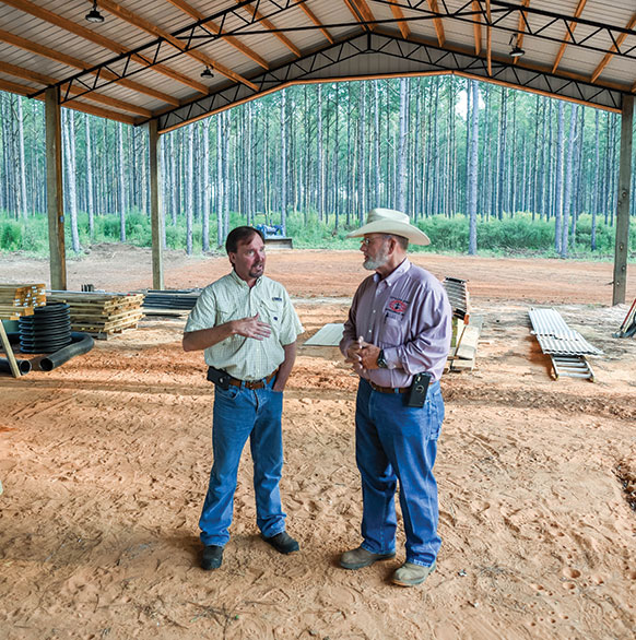 Steve Bozeman and Glenn Crumpler in the pole barn behind the barndo