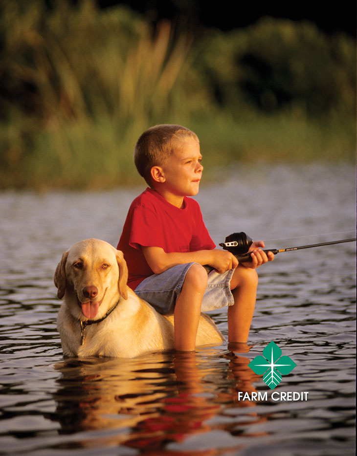 A boy and his dog fishing