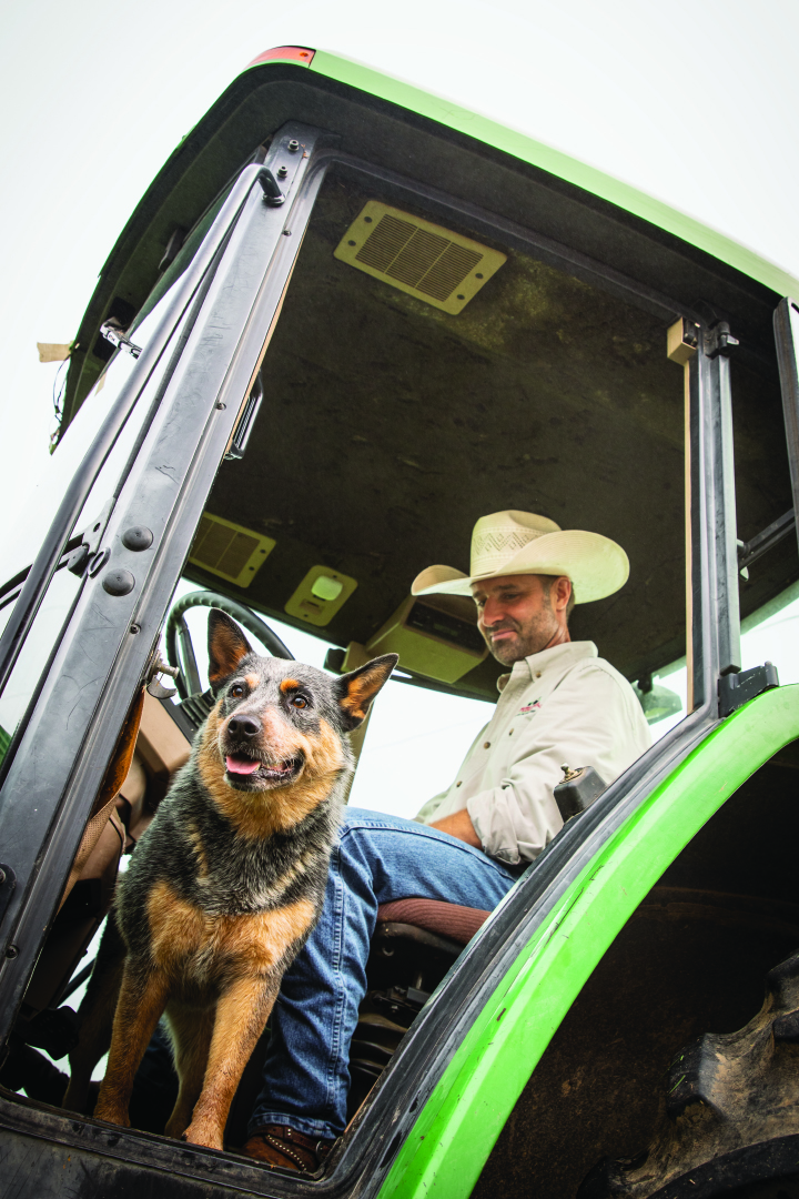 Greg and dog on tractor