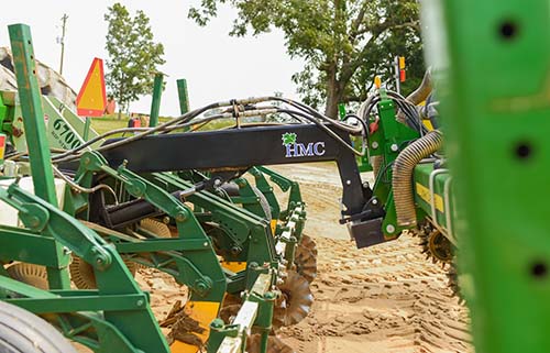 photo of the HMC Quick Attach, which connects a strip-tiller and a planter together to a tractor so they can cover a field in one pass.