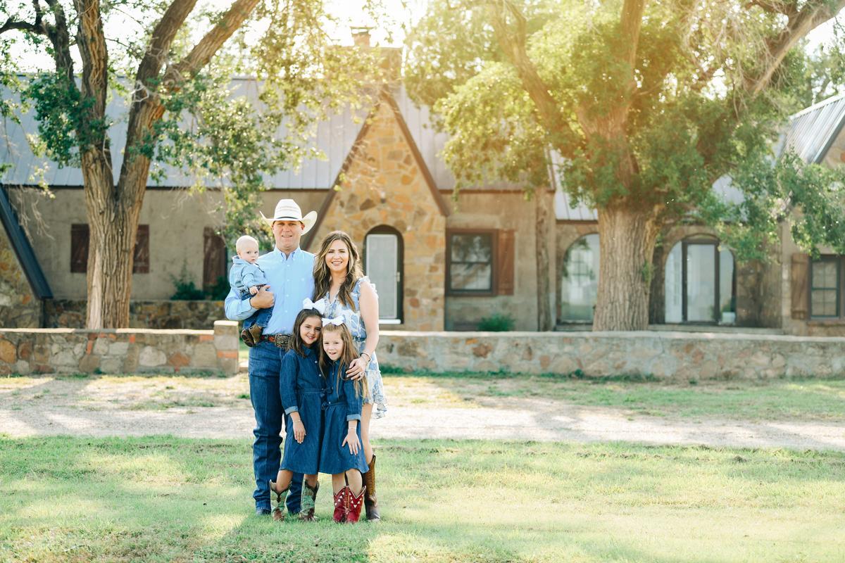 Russell family in front of their home