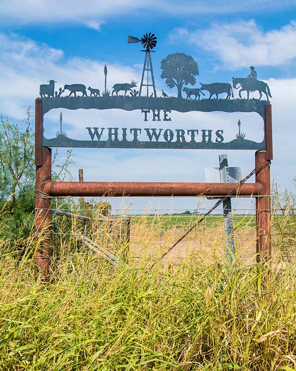 Fence and Whitworth Ranch sign