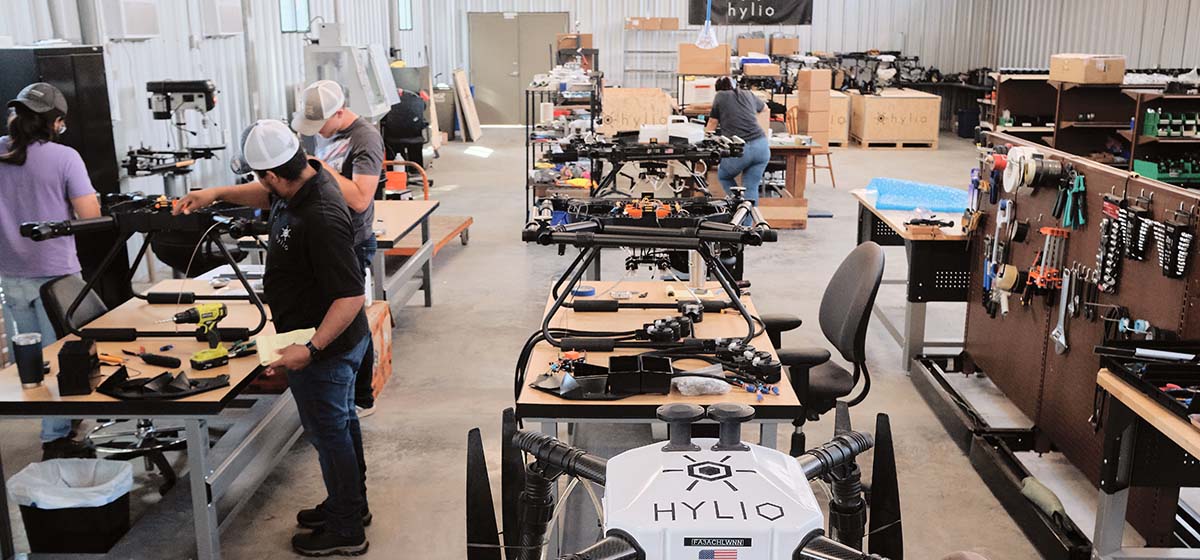 Hylio employees at work manufacturing drones