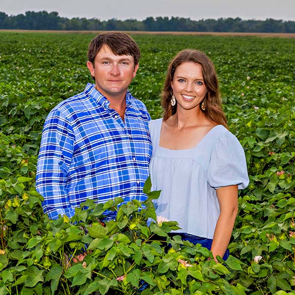 Kody Beavers and Melanie Netterville standing in a field