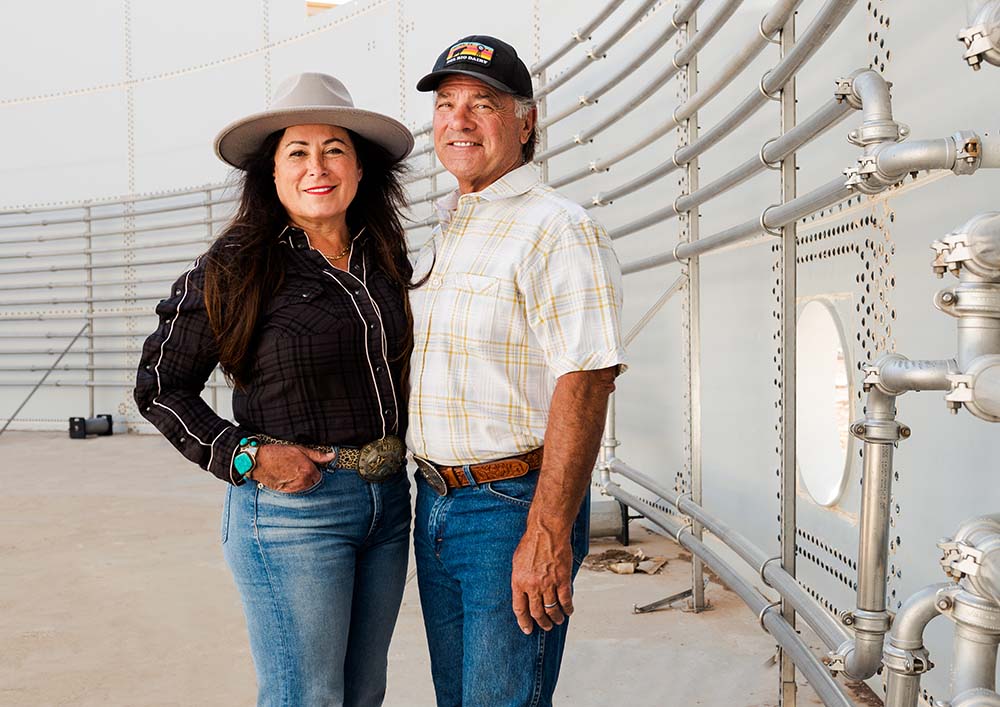 Liz and Rocky Gingg standing in a large effluent tank