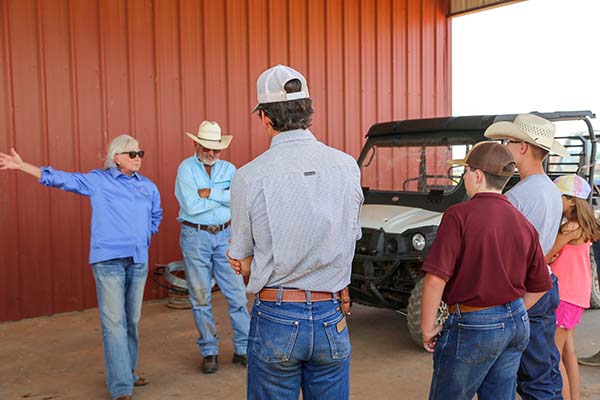 Deborah Clark and Emry Birdwell talking with FFA members