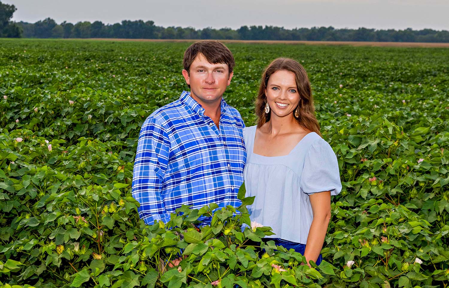 Kody Beavers and Melanie Netterville standing in a field