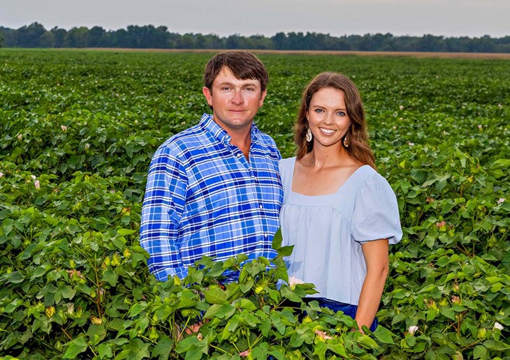 Kody Beavers and Melanie Netterville standing in a field